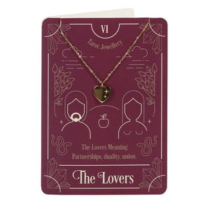 The Lovers tarot card inspired jewelry on a blank greeting card