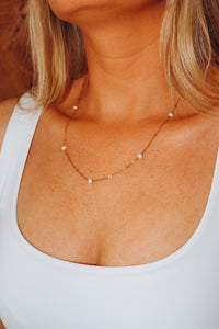 Gold pearl drop necklace
